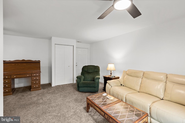 carpeted living room with ceiling fan