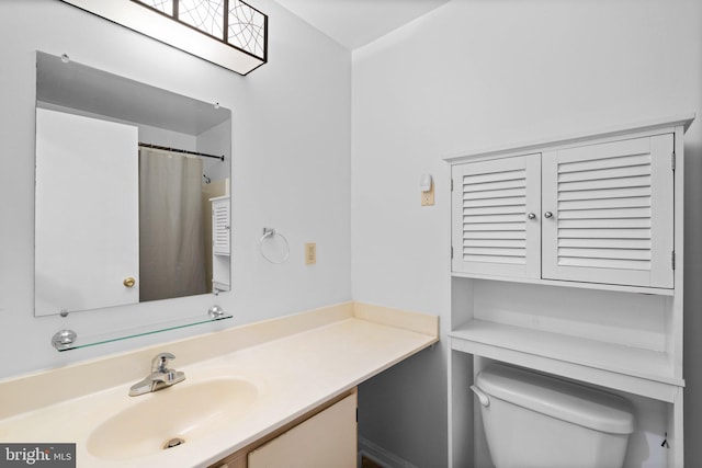 bathroom with vanity, a shower with curtain, and toilet