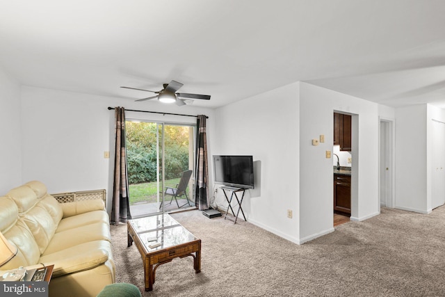 living room featuring light colored carpet and ceiling fan