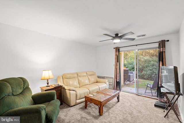 living room featuring light carpet and ceiling fan