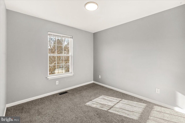 unfurnished room featuring carpet floors