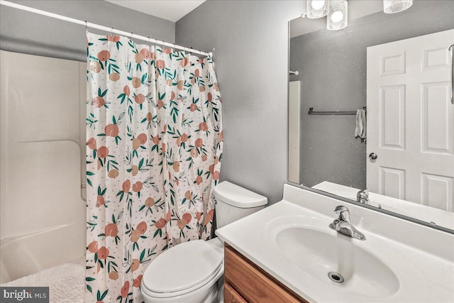 bathroom with a shower with curtain, toilet, and vanity