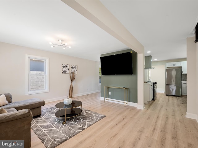 714 W Stephen St, Martinsburg, WV 25401 - living area with light wood-style floors, recessed lighting, a chandelier, and baseboards