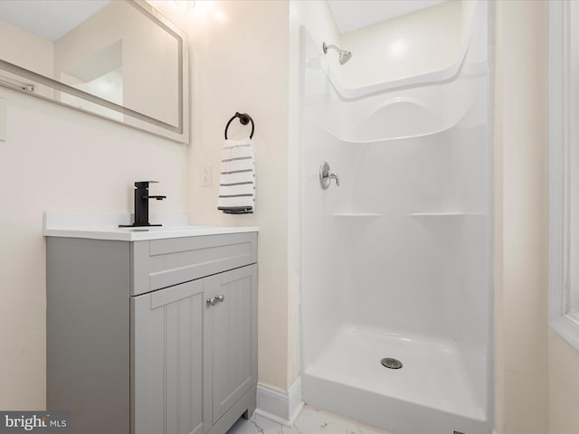 714 W Stephen St, Martinsburg, WV 25401 - bathroom featuring a shower stall, marble finish floor, and vanity