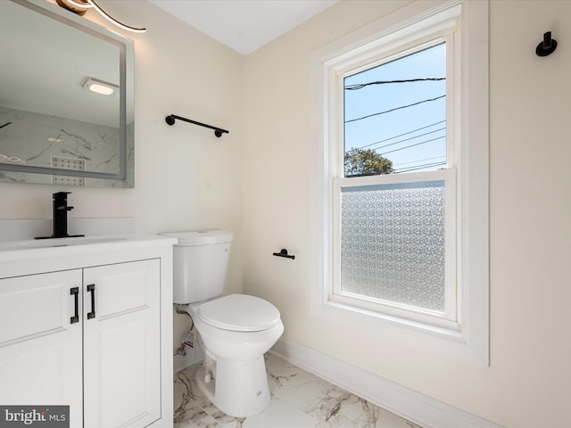 714 W Stephen St, Martinsburg, WV 25401 - bathroom featuring toilet, marble finish floor, vanity, and baseboards