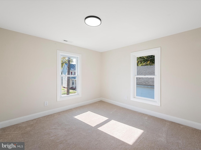 714 W Stephen St, Martinsburg, WV 25401 - unfurnished room featuring visible vents, baseboards, and light carpet