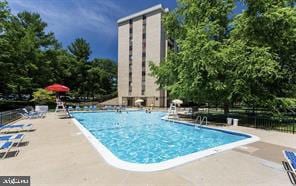 view of swimming pool featuring a patio