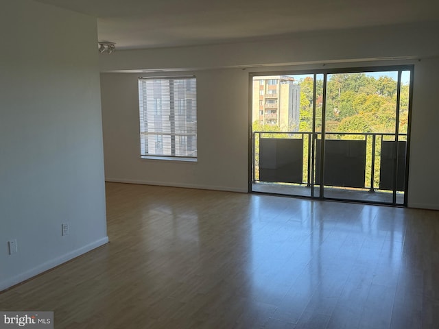 spare room featuring hardwood / wood-style floors