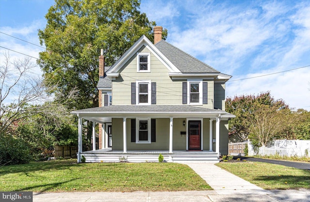 view of front of home featuring a porch and a front lawn