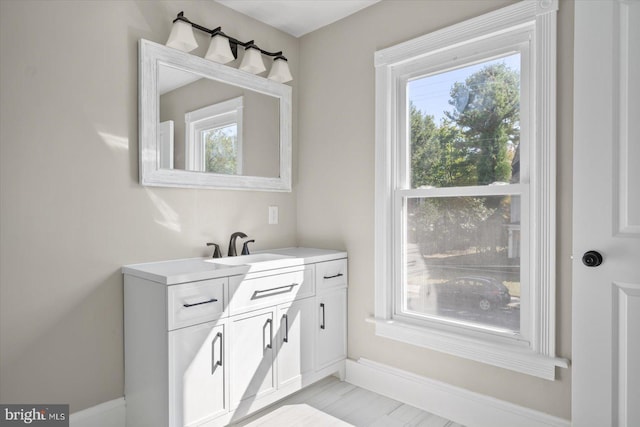 bathroom with vanity and plenty of natural light