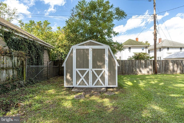 view of outdoor structure featuring a lawn