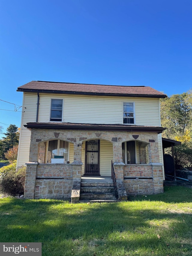 20403 Morgan St SW, Midlothian, MD 21543 - view of front of home with stone siding, a front yard, and covered porch