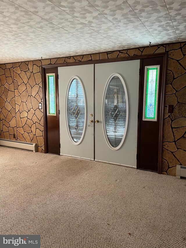 20403 Morgan St SW, Midlothian, MD 21543 - entrance foyer featuring a baseboard radiator and carpet floors