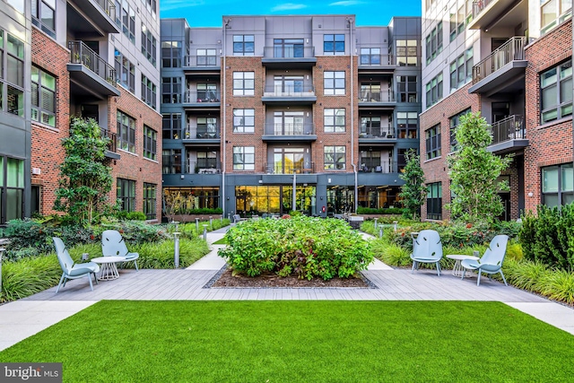 view of home's community with a lawn