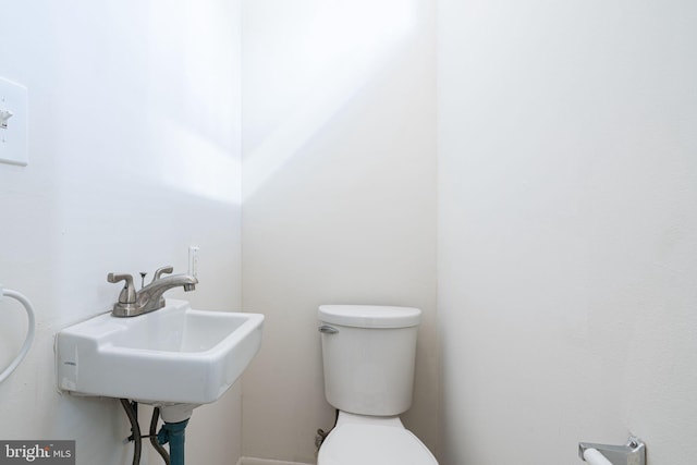 bathroom with sink and toilet