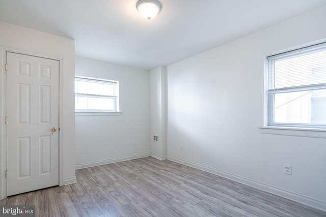 spare room with light hardwood / wood-style floors