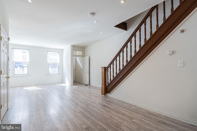 unfurnished living room featuring light hardwood / wood-style flooring