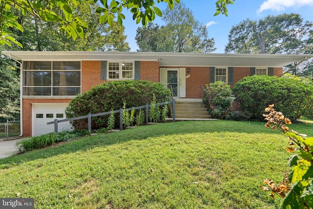 view of front facade featuring a front lawn, a garage, and a sunroom