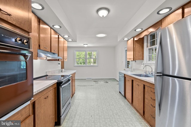 kitchen with appliances with stainless steel finishes and sink