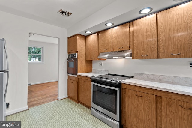 kitchen featuring appliances with stainless steel finishes and light wood-type flooring