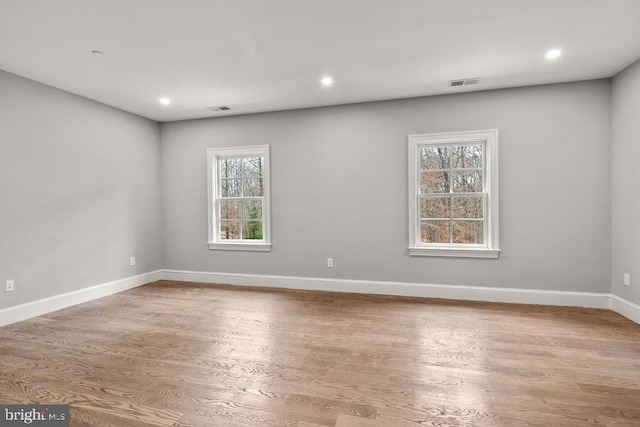 empty room with wood-type flooring