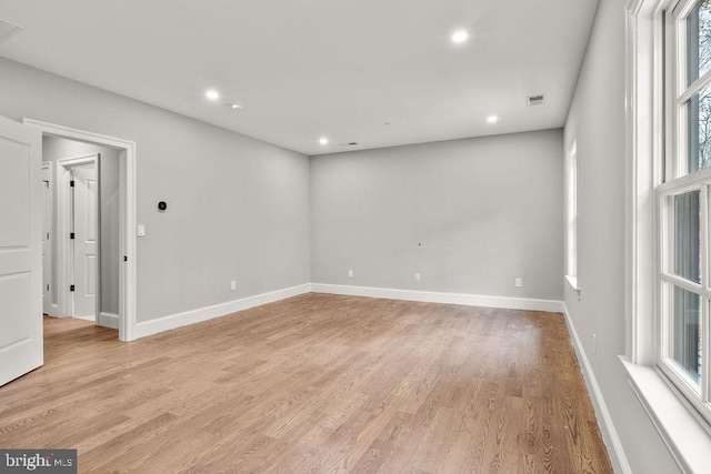 spare room featuring light hardwood / wood-style floors