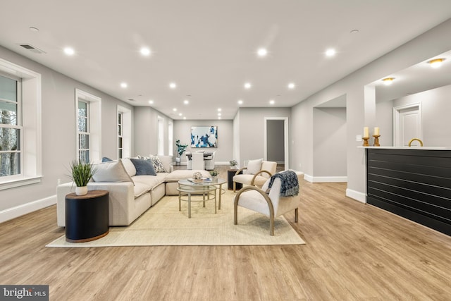 living room with light hardwood / wood-style flooring