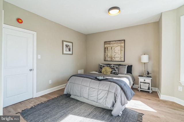 bedroom with light wood-type flooring