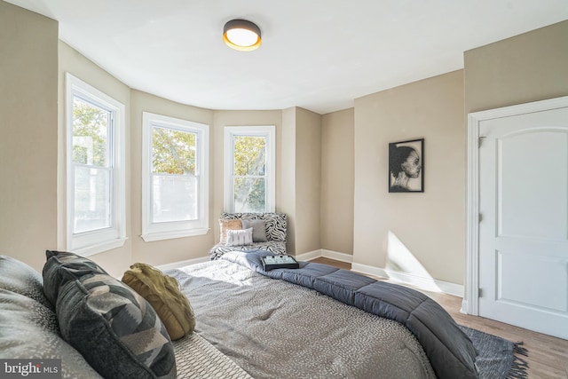 bedroom with light wood-type flooring