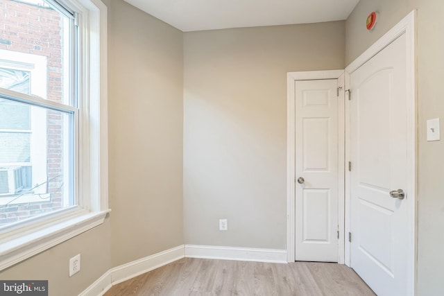 spare room featuring light hardwood / wood-style floors