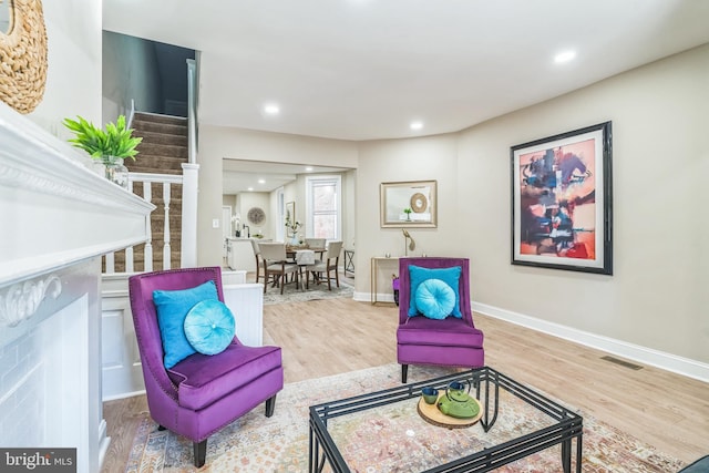 sitting room featuring light hardwood / wood-style floors