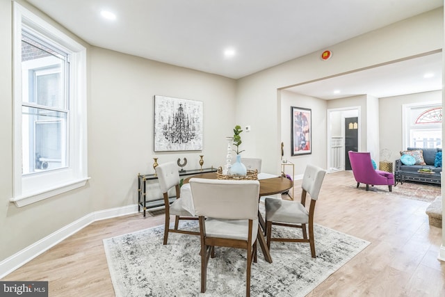 dining space featuring light hardwood / wood-style floors and a wealth of natural light