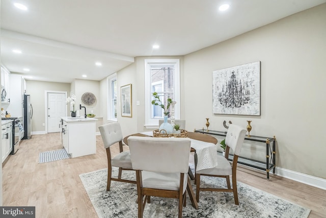 dining space featuring light hardwood / wood-style flooring