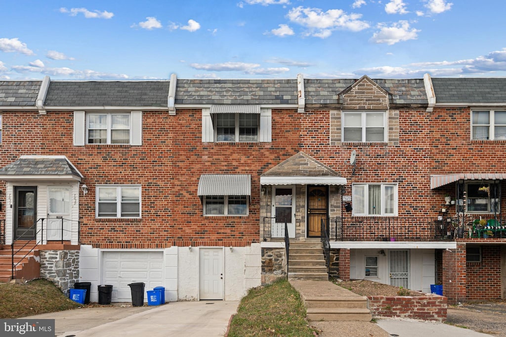 multi unit property featuring a garage