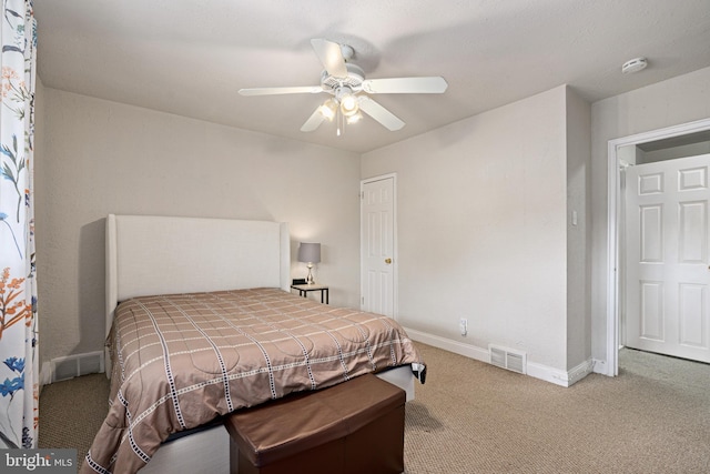 bedroom featuring light carpet and ceiling fan