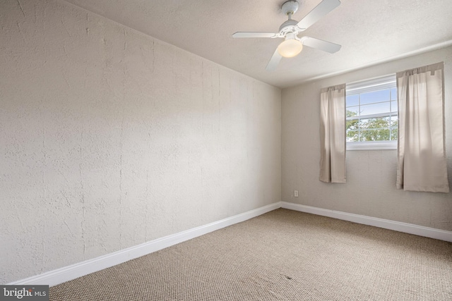 unfurnished room featuring carpet flooring and ceiling fan