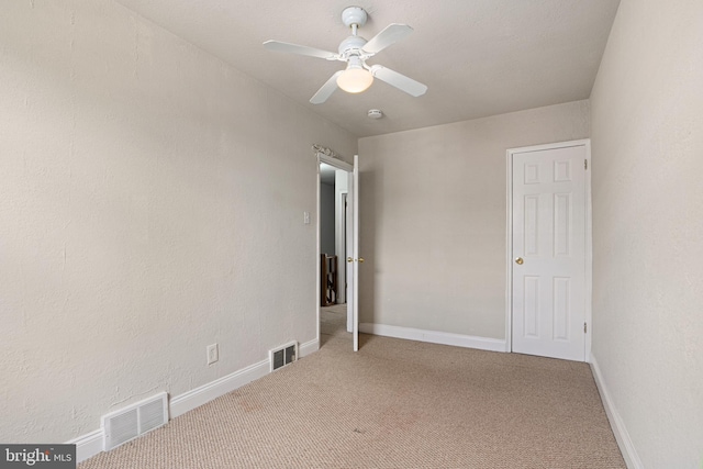 unfurnished bedroom featuring ceiling fan and carpet floors