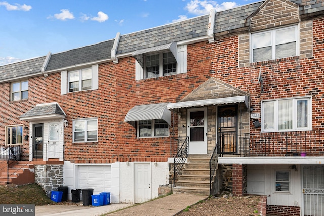 multi unit property featuring a garage