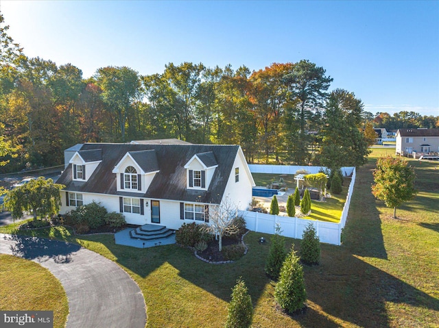 cape cod-style house with a porch and a front yard