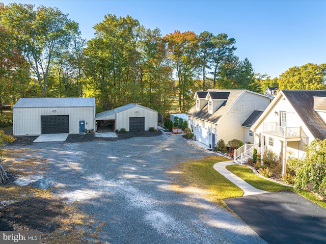 exterior space featuring a garage and an outdoor structure