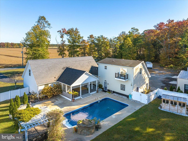 view of pool with a yard and a patio area