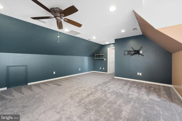 additional living space with ceiling fan, carpet, and lofted ceiling