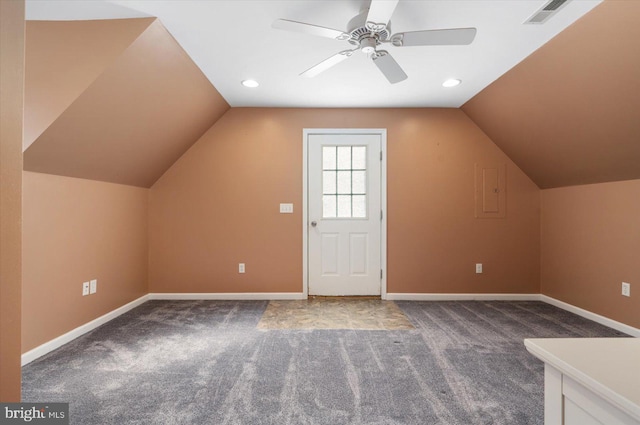 additional living space featuring ceiling fan, carpet, and lofted ceiling