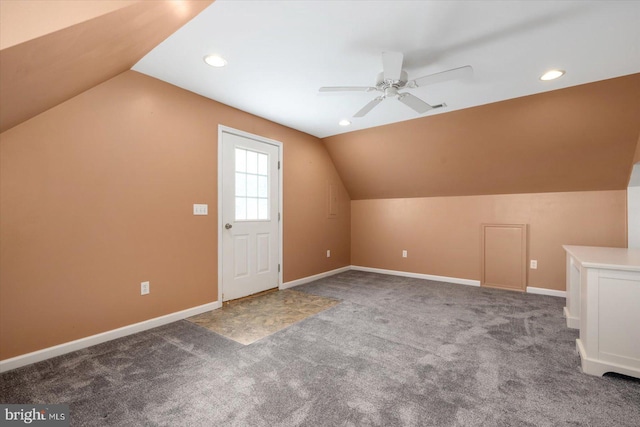 additional living space with ceiling fan, vaulted ceiling, and carpet floors