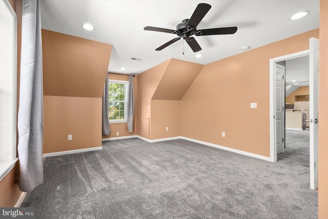 bonus room with ceiling fan, carpet flooring, and vaulted ceiling