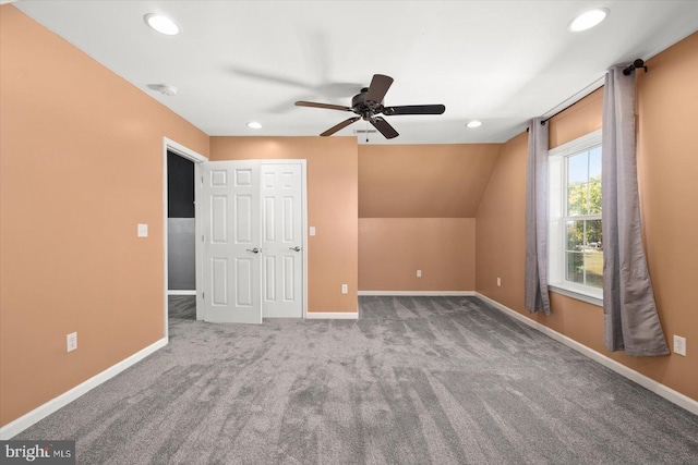 bonus room featuring ceiling fan, carpet flooring, and lofted ceiling