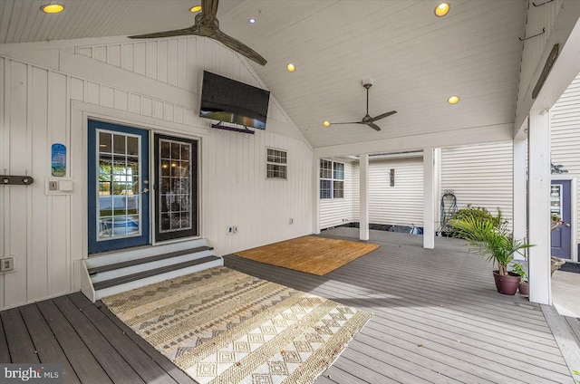 wooden terrace featuring ceiling fan