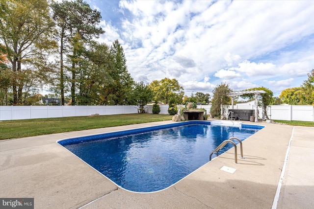 view of swimming pool with a patio and a yard