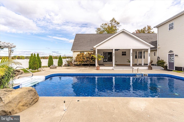 view of swimming pool with a patio area