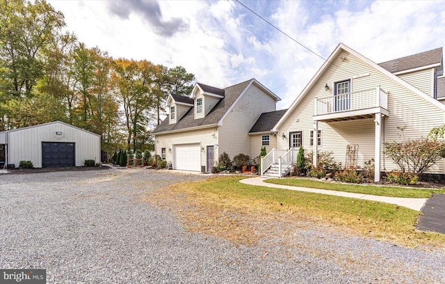 view of front of house featuring a balcony and a garage